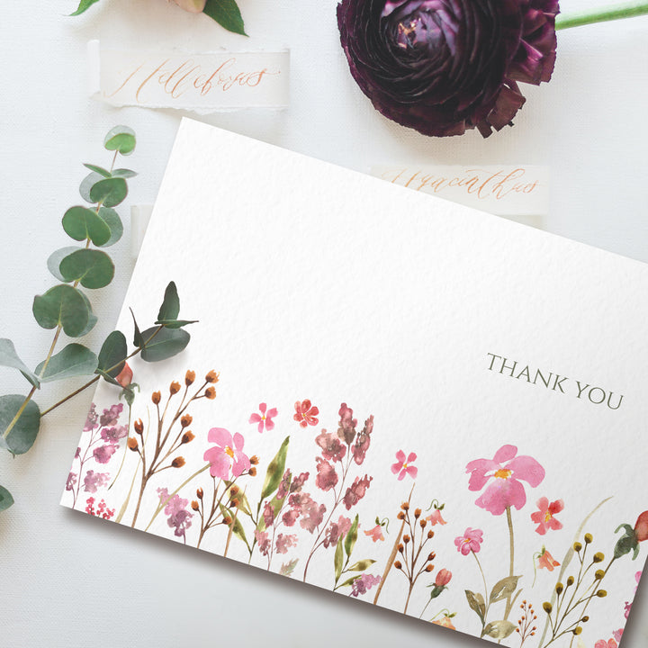 a thank you card with flowers on it