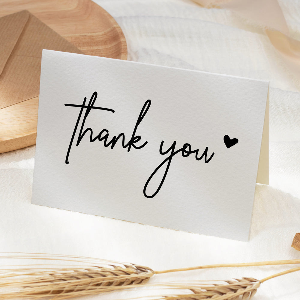 a thank card with the word thank written on it