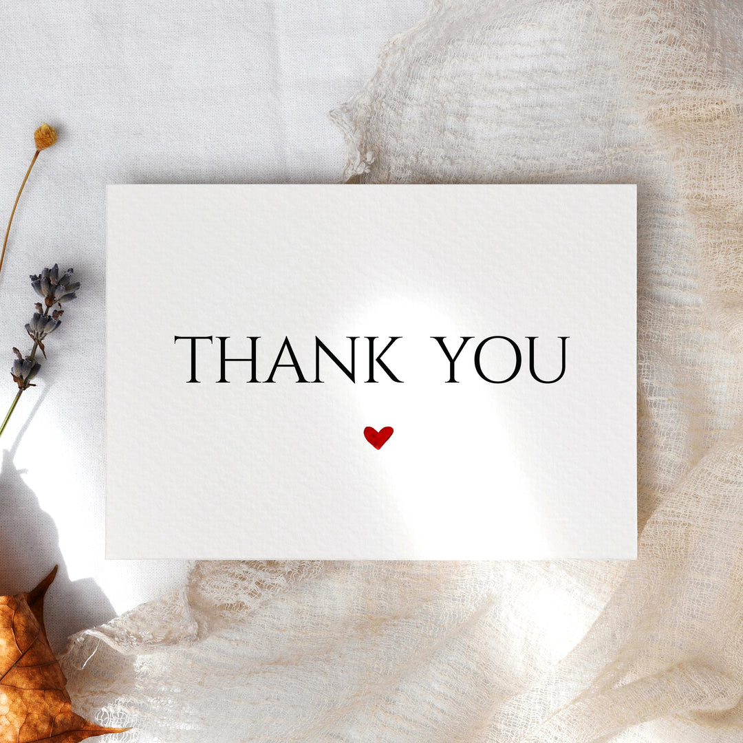 a thank you card with a heart on it