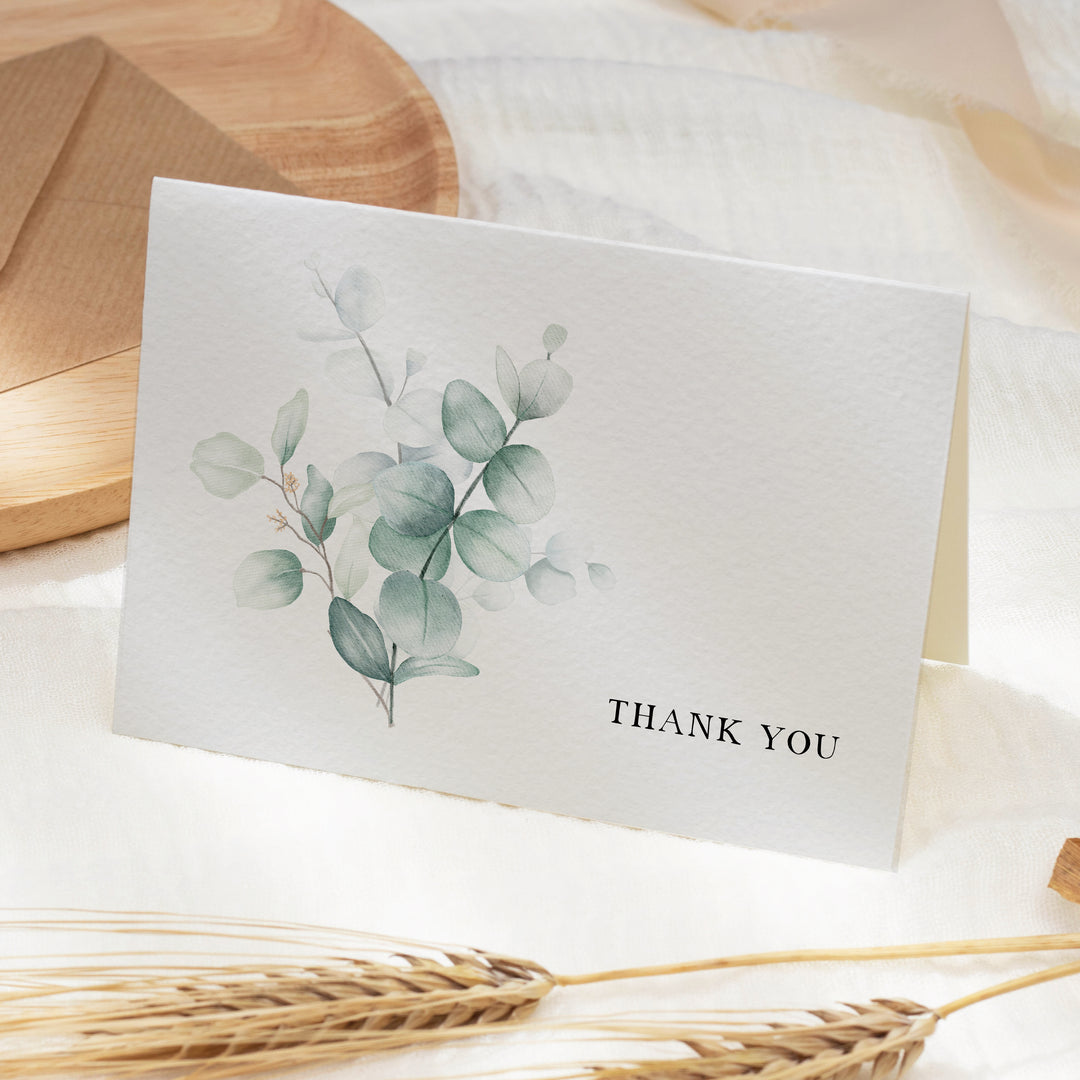 a thank you card sitting on top of a table