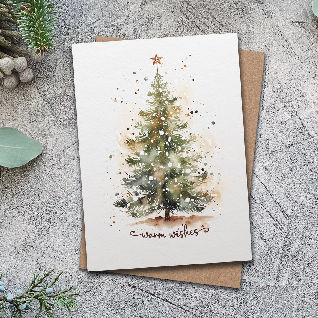 a card with a watercolor christmas tree on it