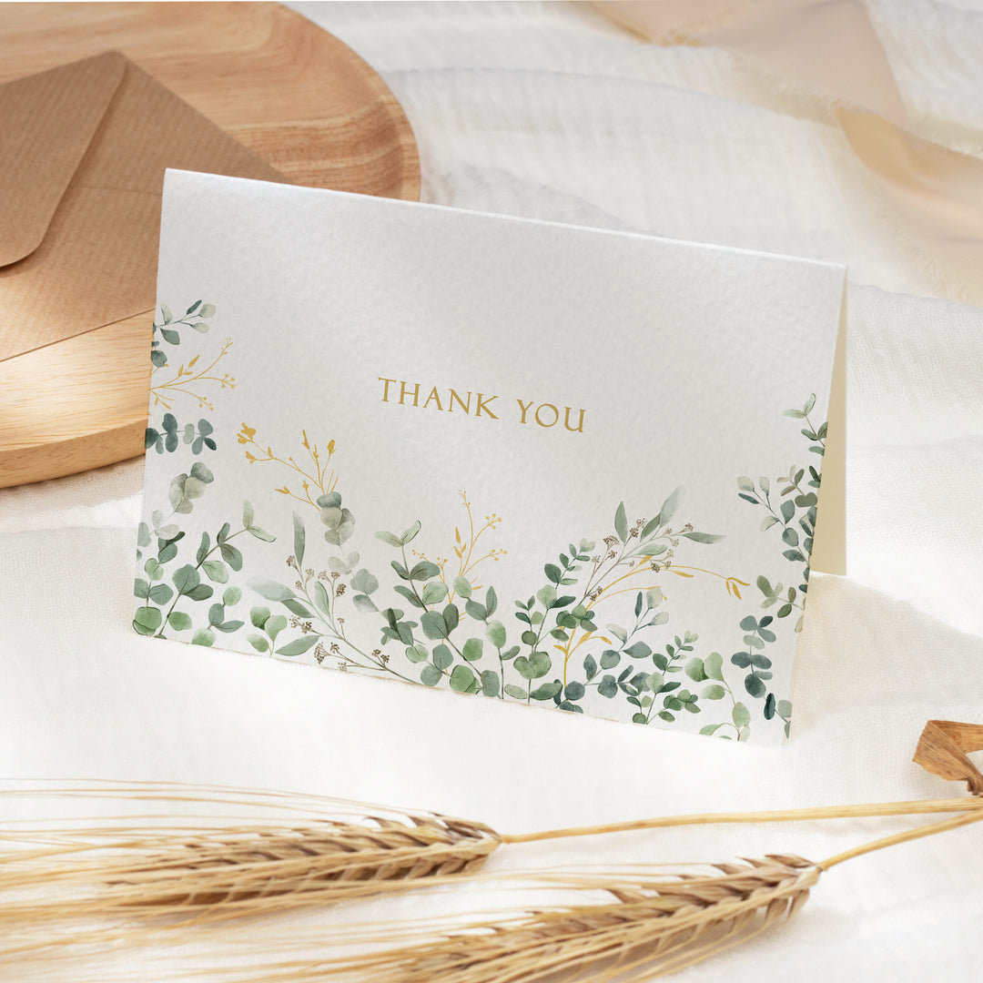 a thank you card sitting on top of a table