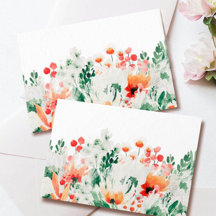 two cards with watercolor flowers on them