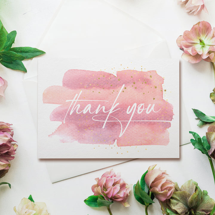 a thank you card surrounded by pink flowers