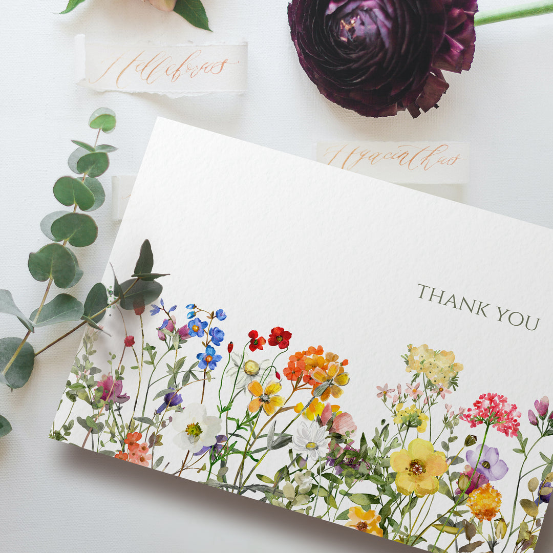 a thank you card with flowers on it