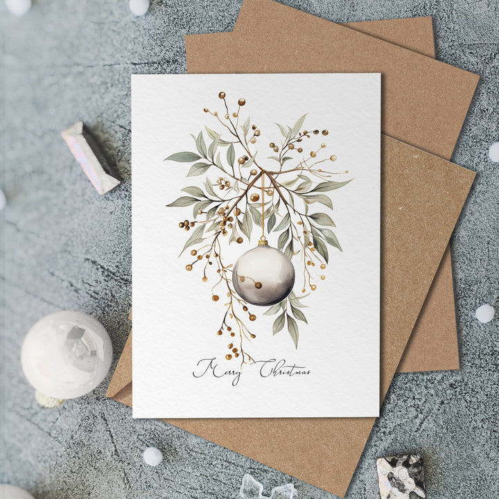 a card with a christmas ornament on it