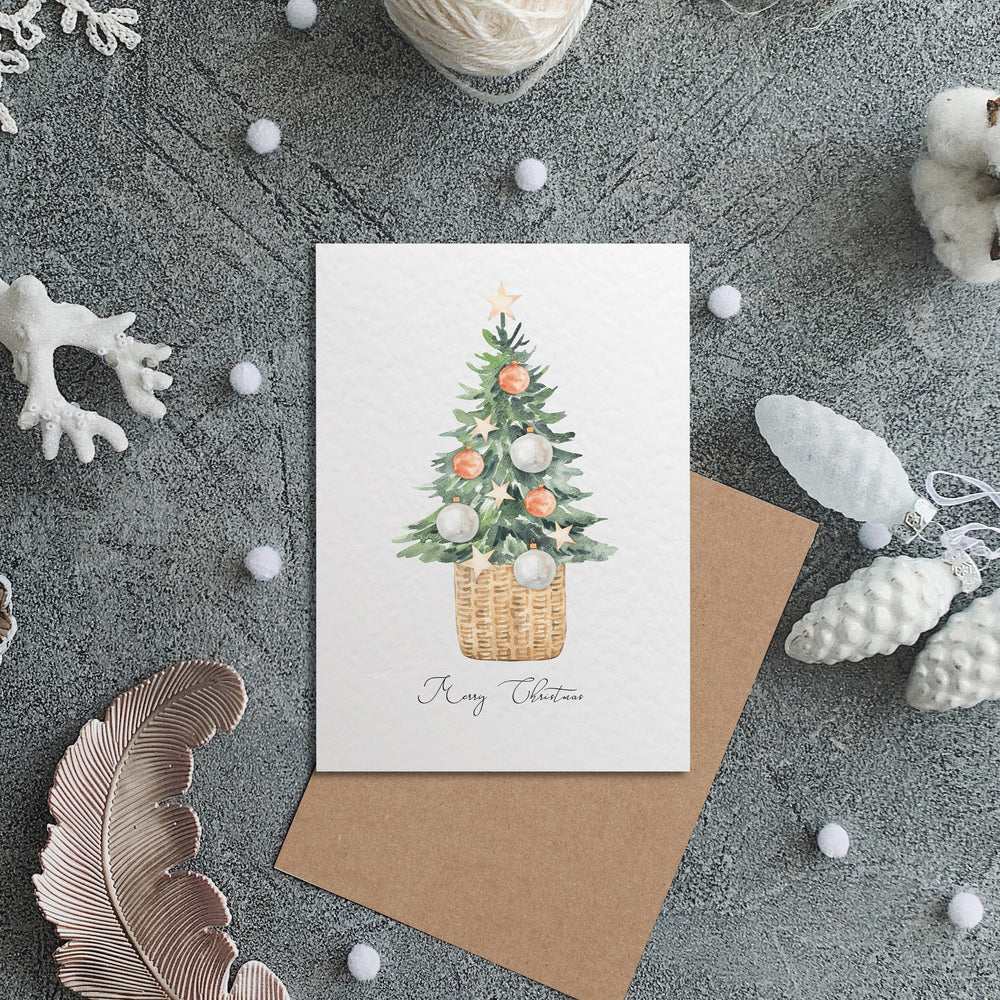 a card with a christmas tree in a basket