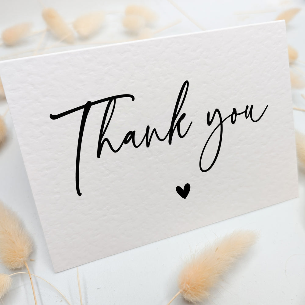 a thank you card with a heart on it