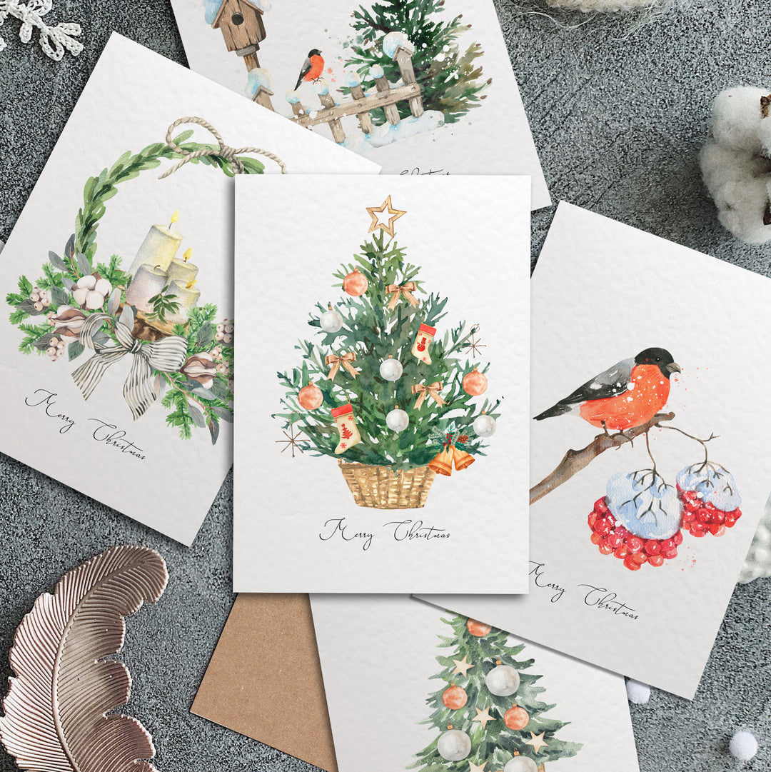 four christmas cards with a christmas tree on them