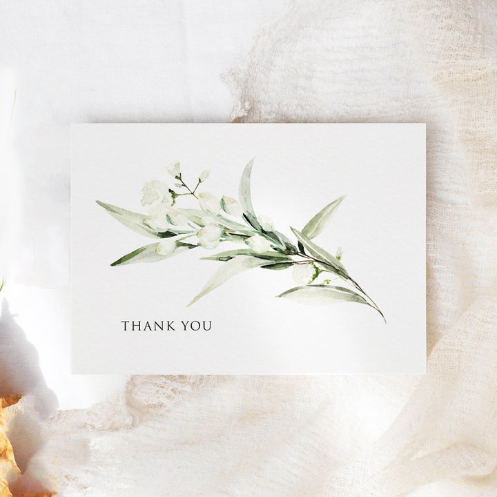 a thank card with a watercolor painting of flowers