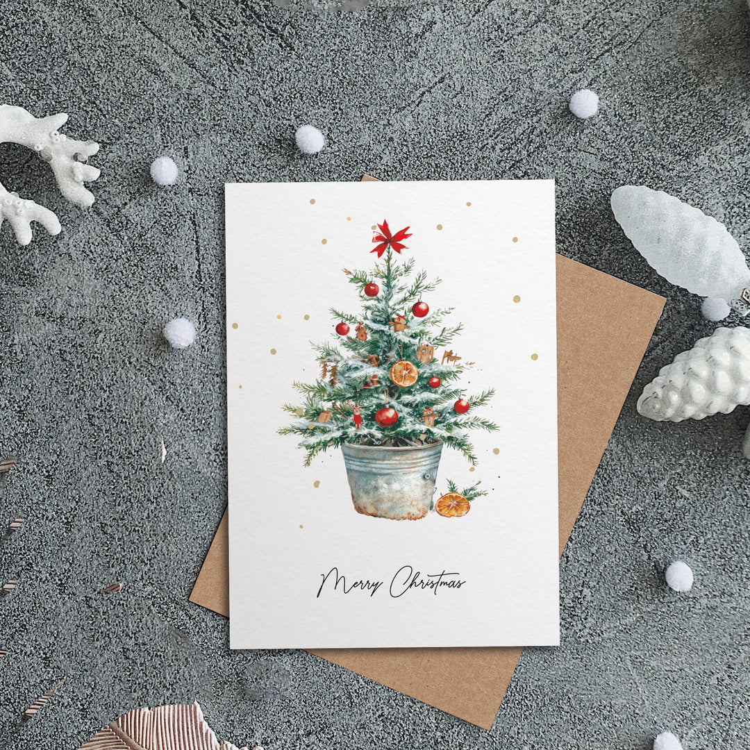 a christmas card with a christmas tree in a pot