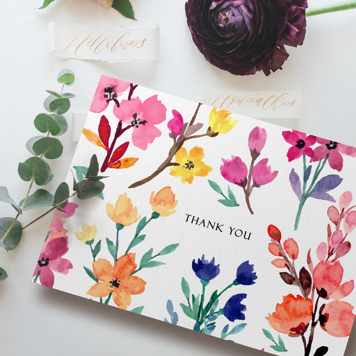 a thank card with watercolor flowers on it