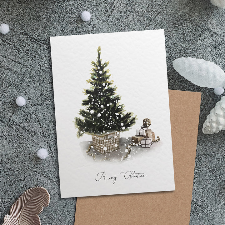 a card with a christmas tree and a sleigh