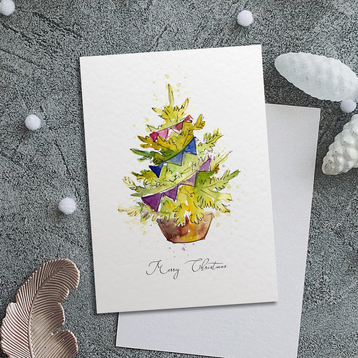 a card with a potted plant on top of it