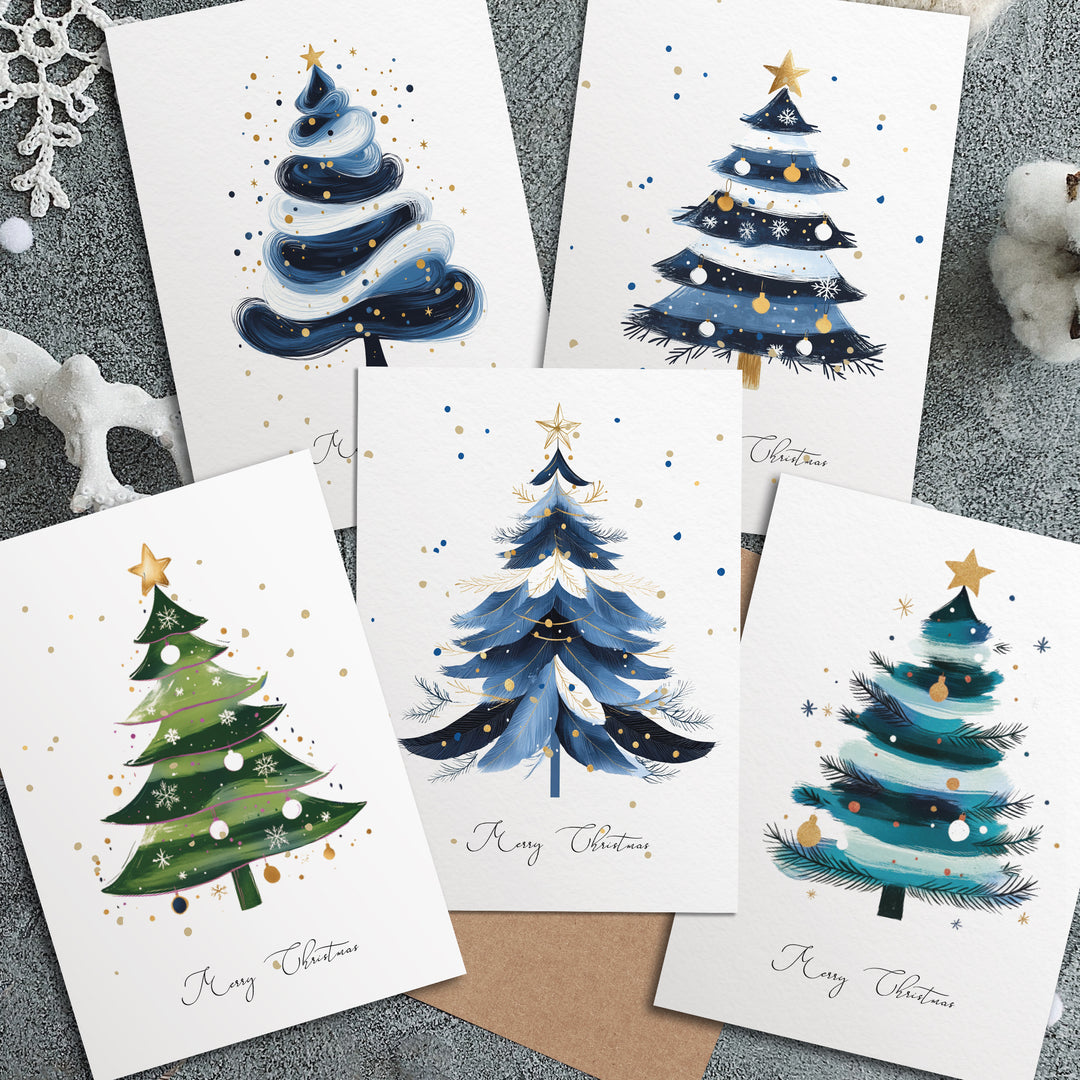 four christmas cards with watercolor trees on them