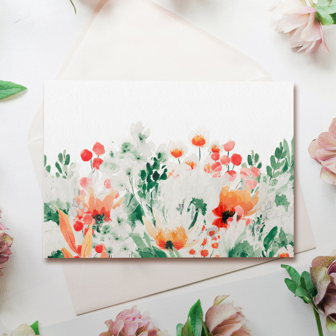 a card with watercolor flowers on it