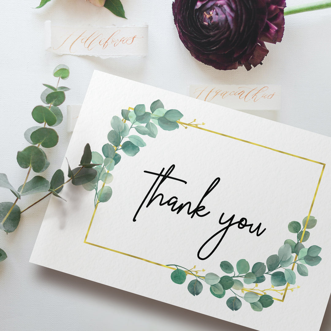 a thank you card with greenery on it