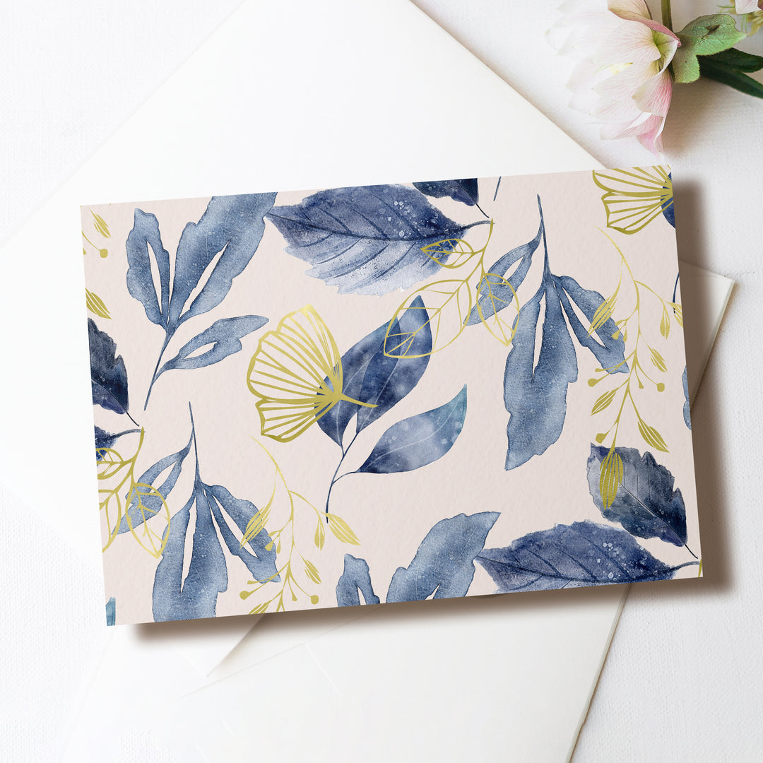 a card with blue leaves on it