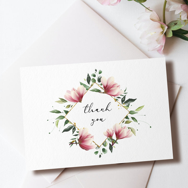 a thank you card with pink flowers and greenery