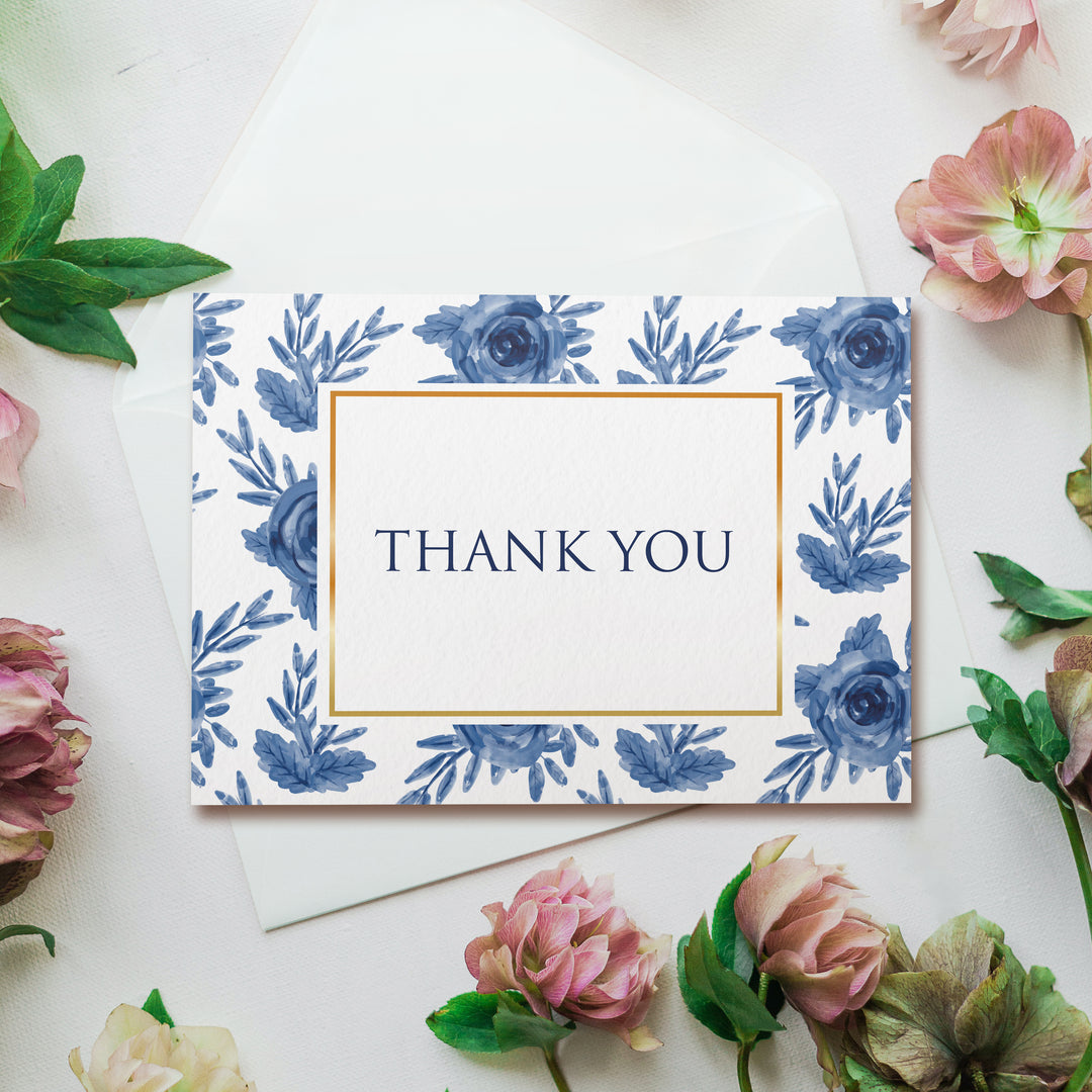 a thank you card surrounded by flowers