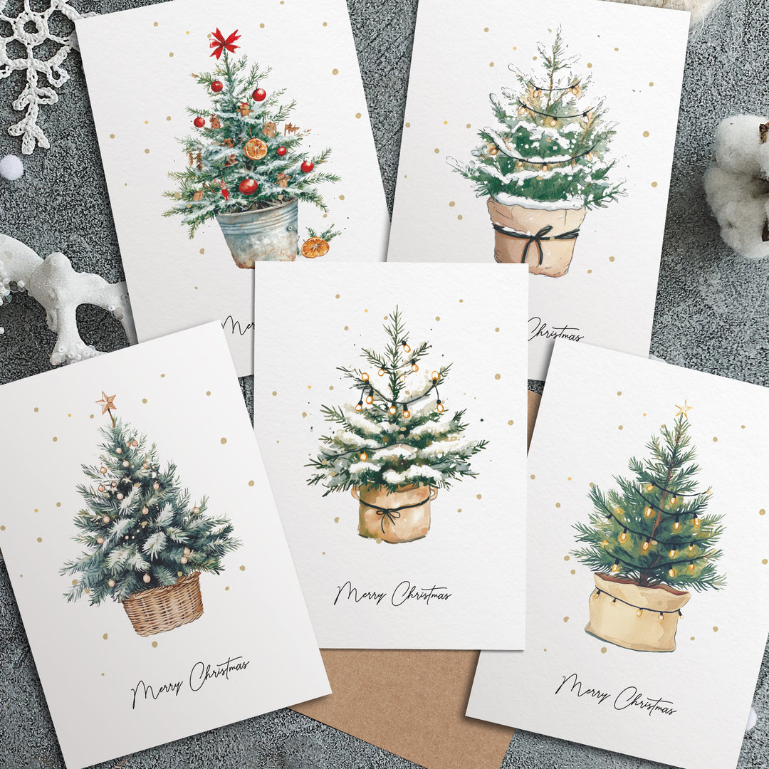 four christmas cards with a christmas tree in a pot