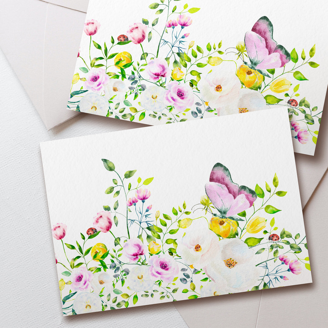 two cards with watercolor flowers on them