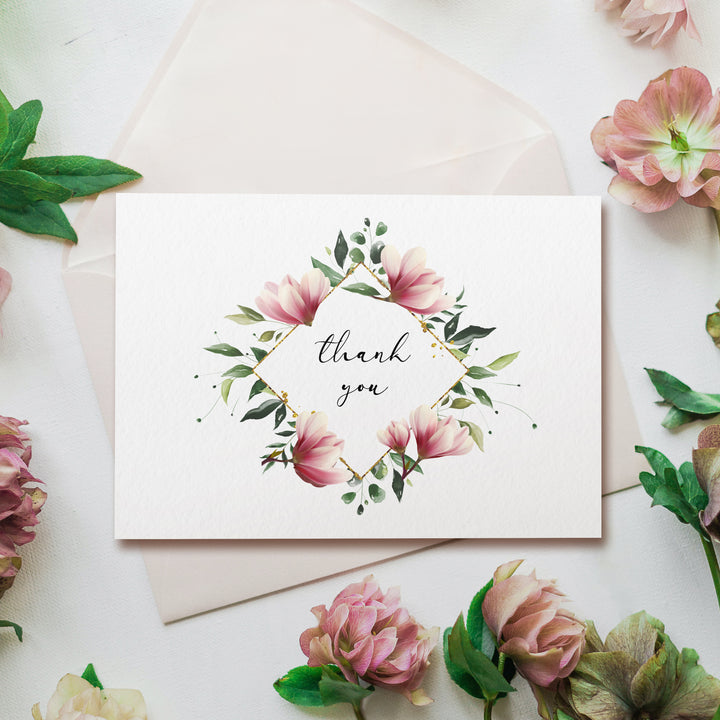 a thank you card with pink flowers and greenery