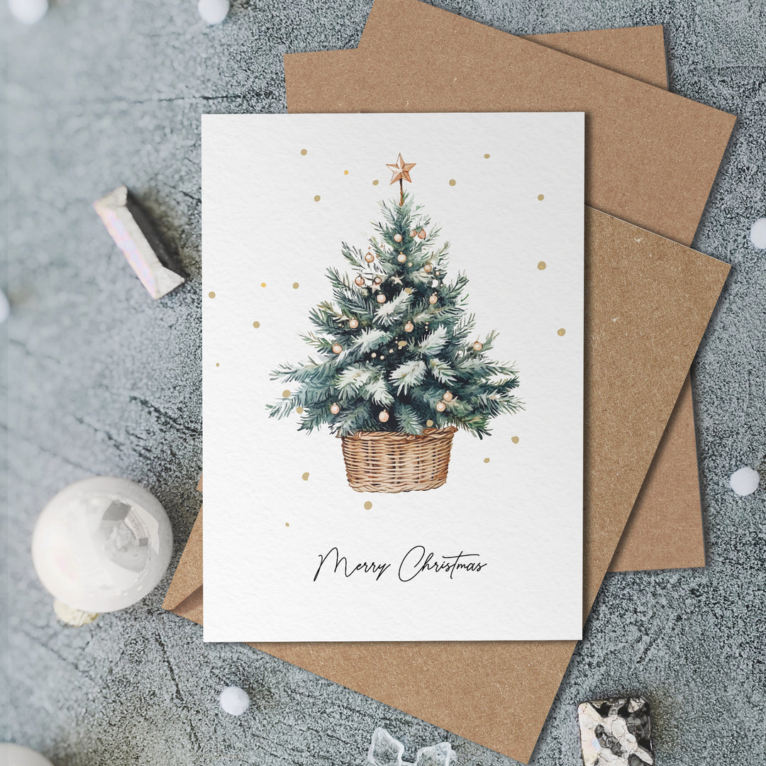 a christmas card with a christmas tree in a basket