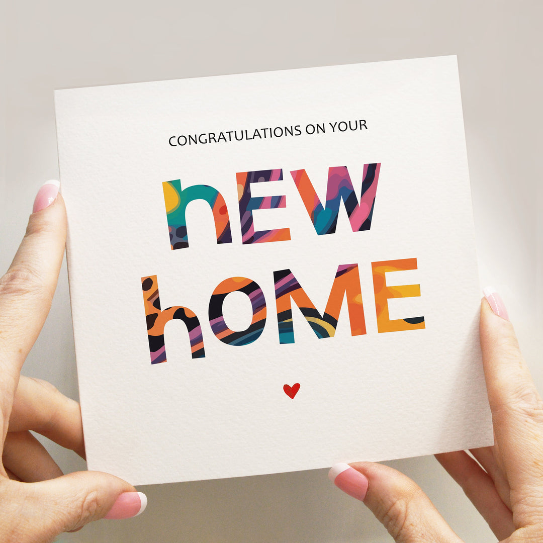 congratulations on your new home card with a heart and colourful playful block letters