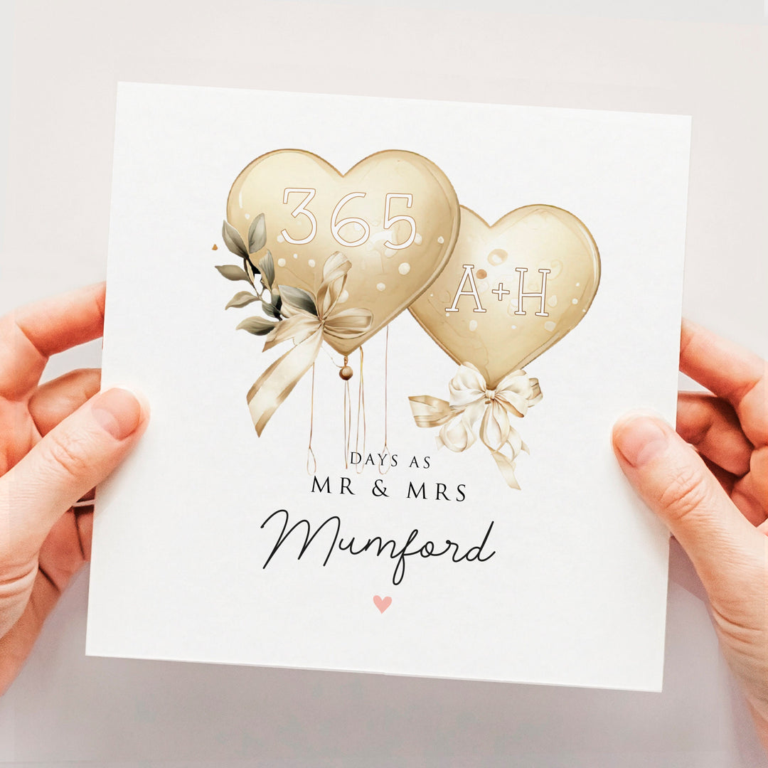 1st Anniversary Card, Classy Elegant 365 Days Wedding Anniversary Card, Personalised First Anniversary Card, 1 Year Married with two intertwining gold balloons and ribbons